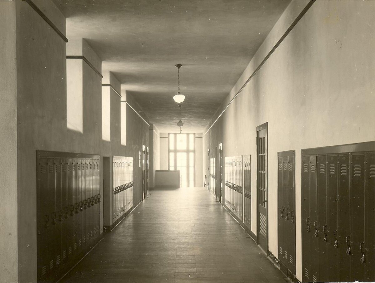 Historic school hallway lined with lockers